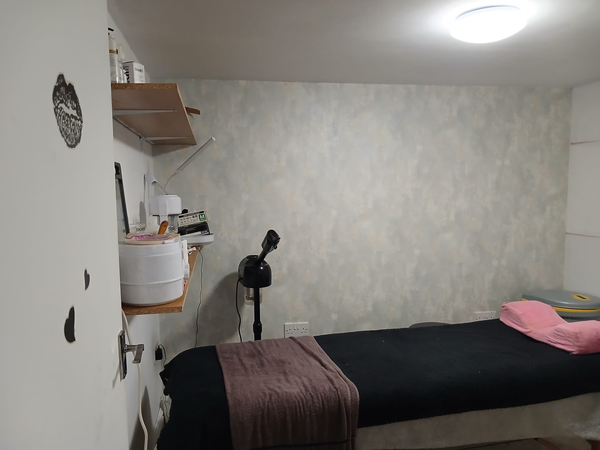 Blush and charcoal treatment room at Maya Beauty Rituals with rose-gold details